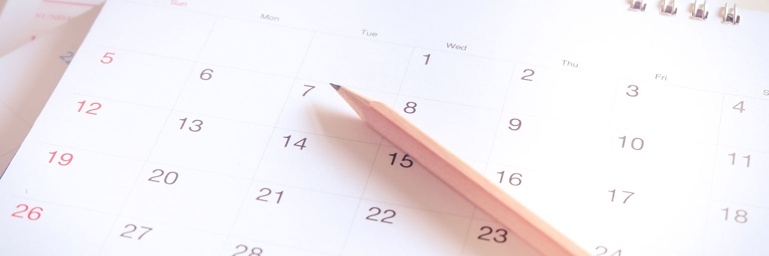 Pencil on to of a calendar